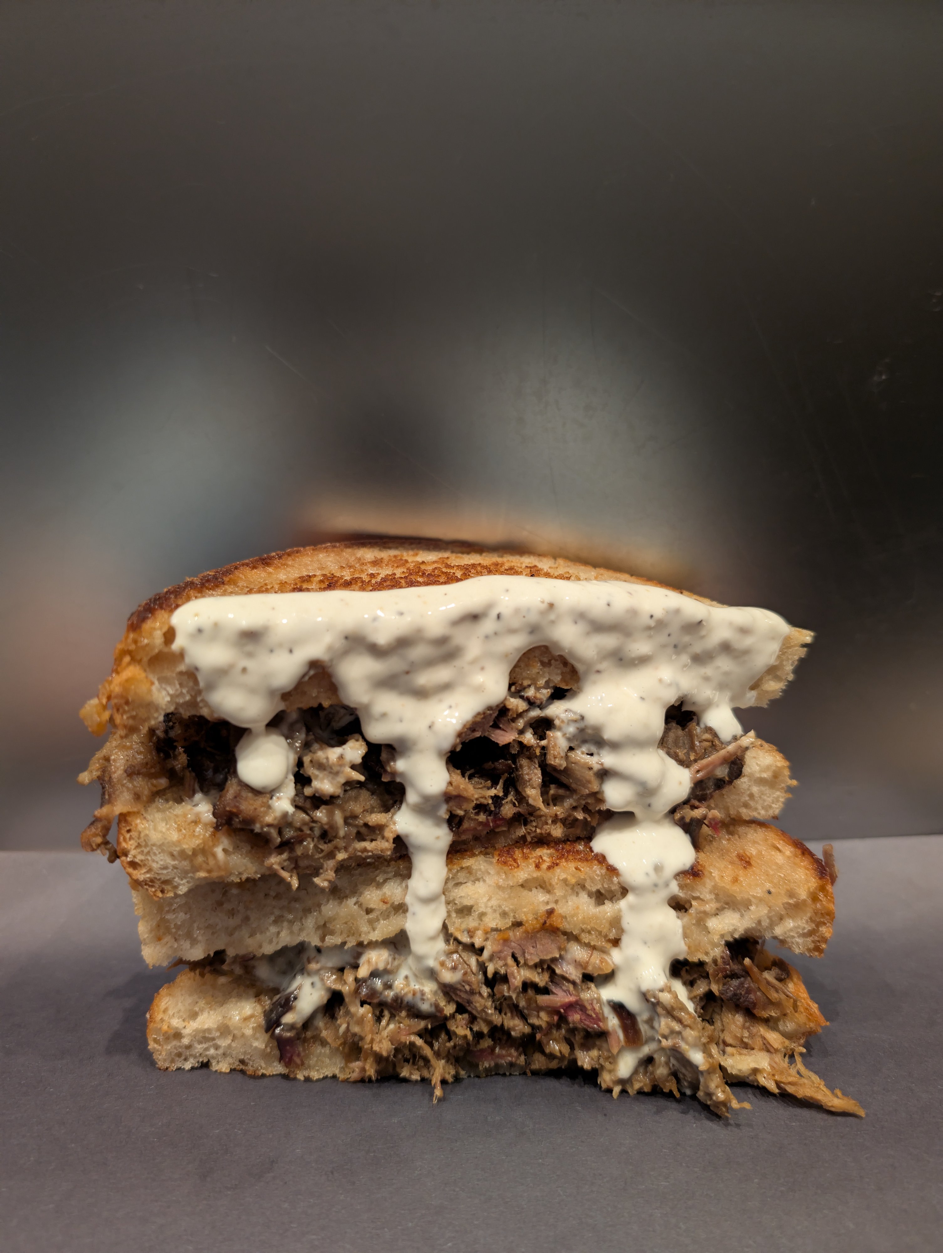 Premium Smoked Beef piled high on toasted Springfield Sourdough with Horseradish Mayo Sauce