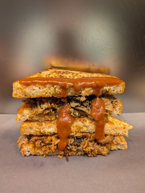 Smoked Beef piled high on toasted Springfield Sourdough with our "Kicked Up" House Sauce.