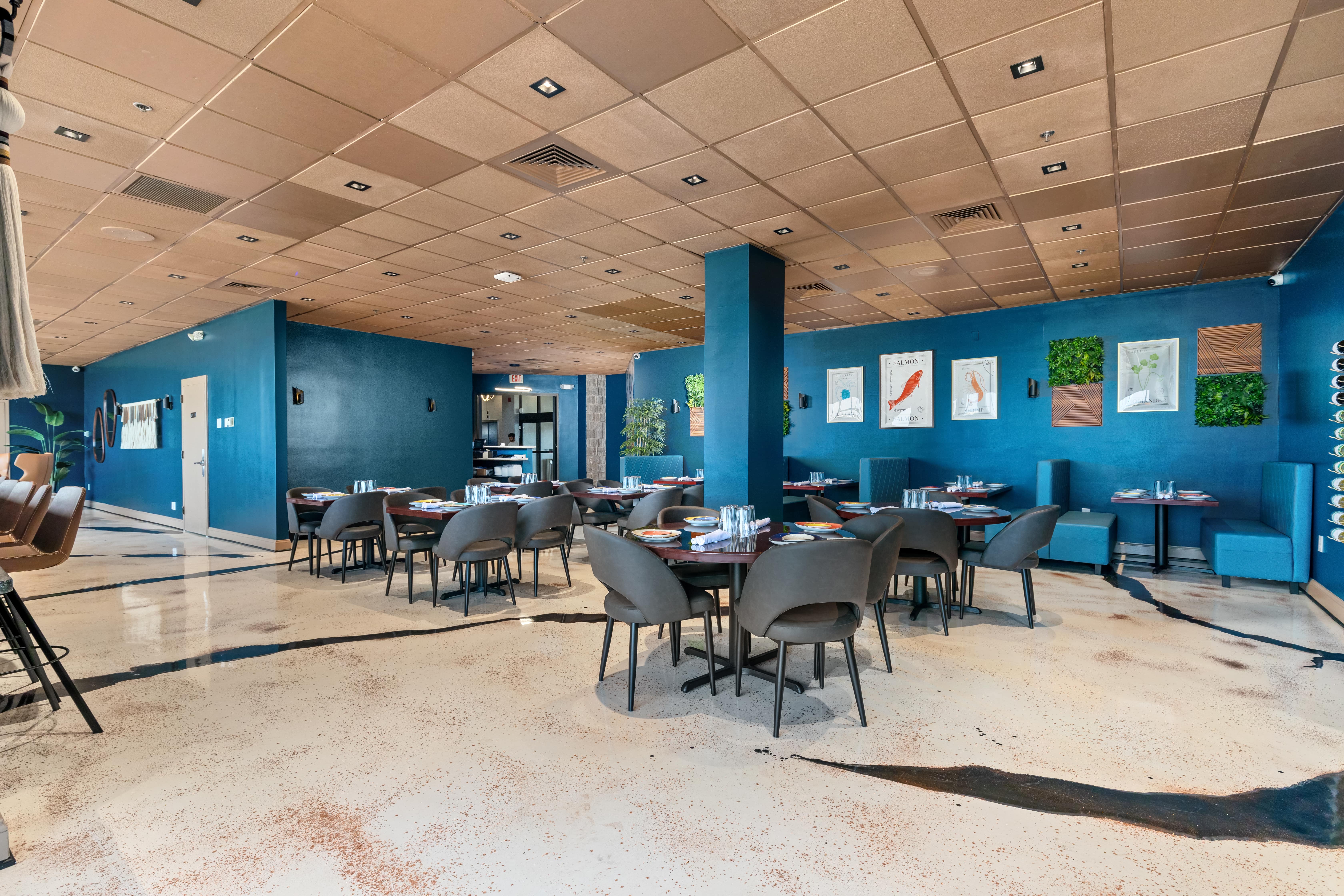 Elegant indoor dining area at RANGSA with warm lighting and modern Indian decor