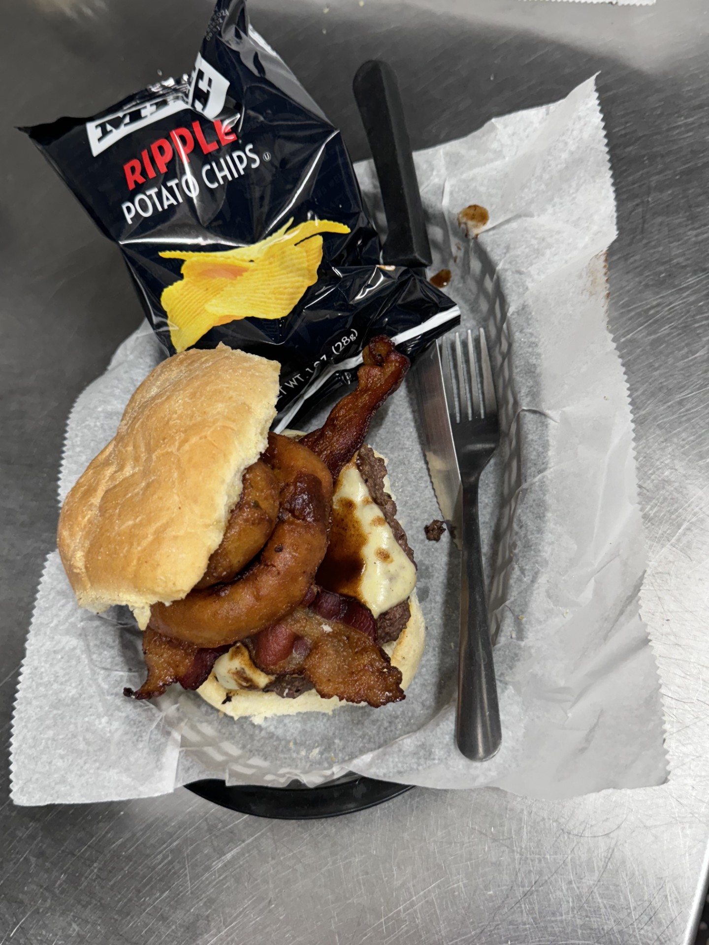 1/2# Burger with A-1 pepperjack cheese and 2 onion rings served with chips