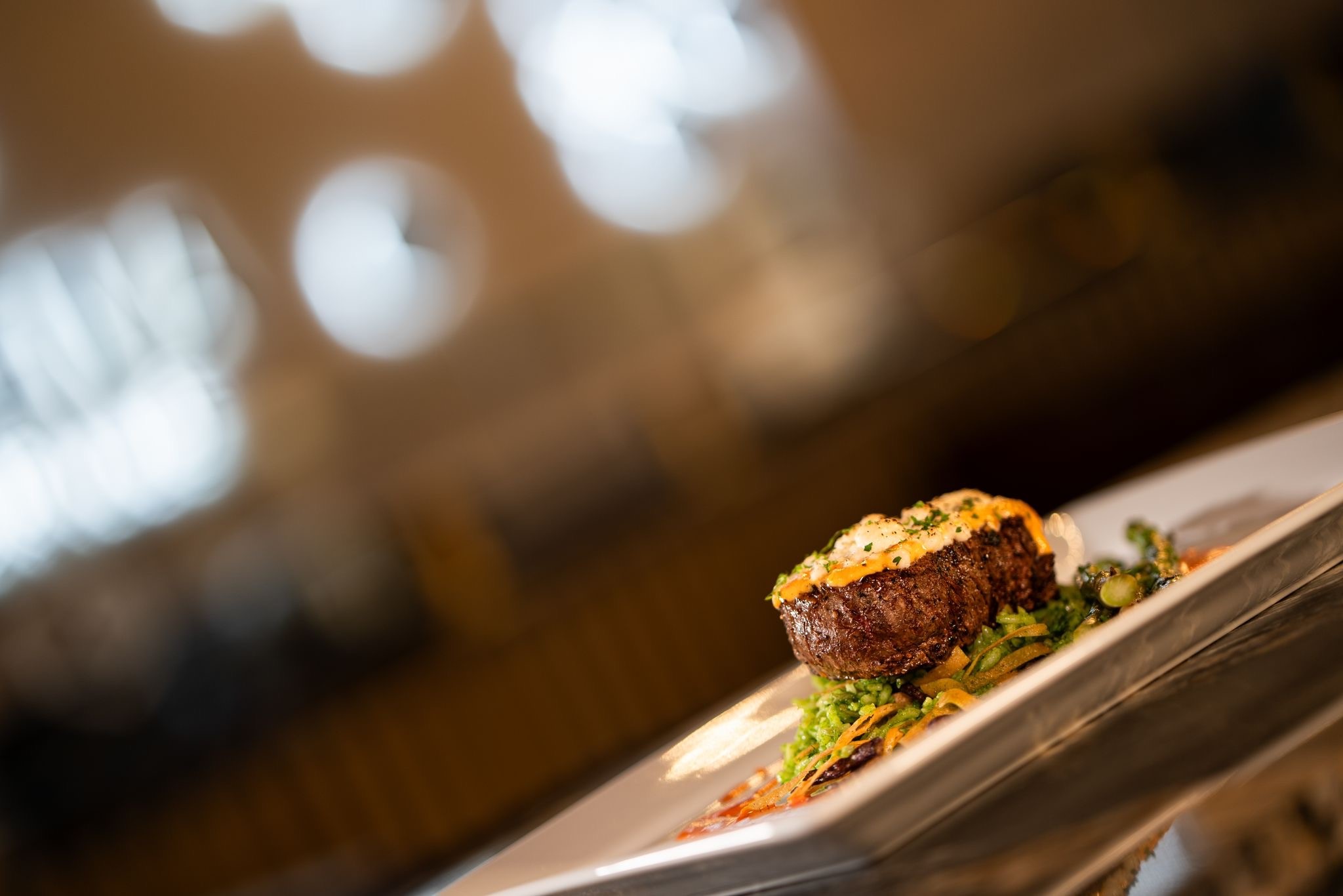 Queso Fresco Tenderloin ⬡ Cilantro rice, blue corn tortilla strips, guajillo butter sauce, grilled asparagus wrapped in bacon.
