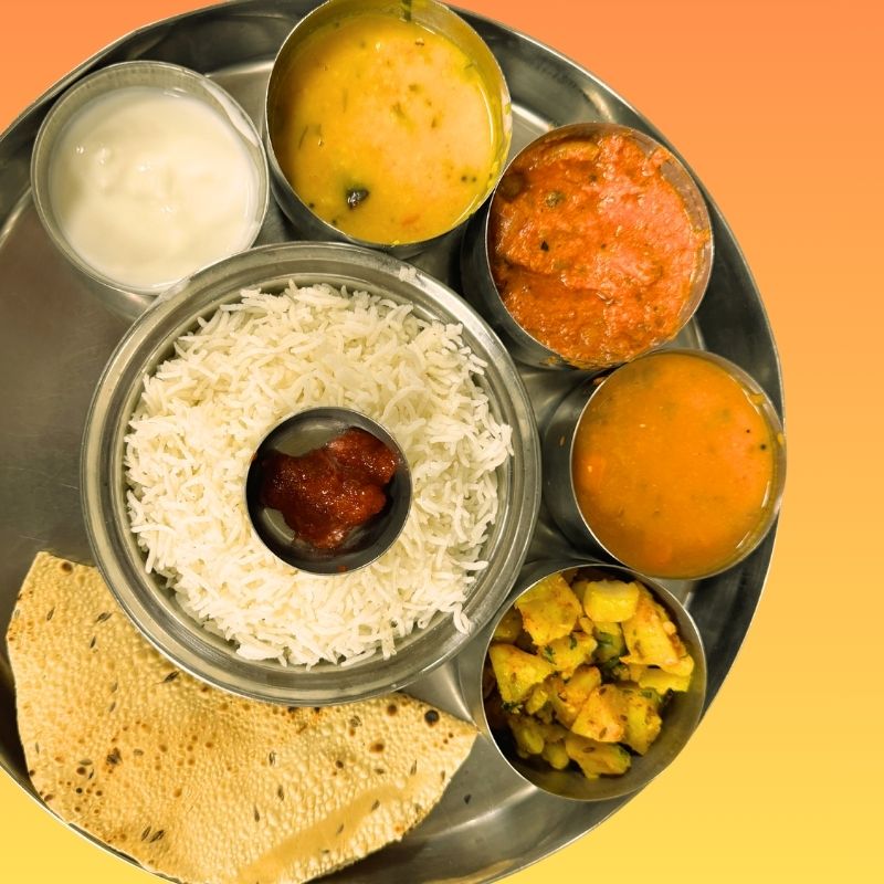 Main Curry (8 Oz) served with a option of Rice/ Naan, Vegetable/Fry Curry, Rasam/ Sambar combined with Dal curry, Yougurt, Pickel & Pappad
